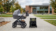 A side-by-side comparison of a compact folded lightweight stroller and a robust full-size stroller in an urban setting.