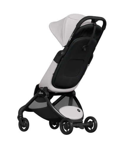 Folded stroller carried on shoulder