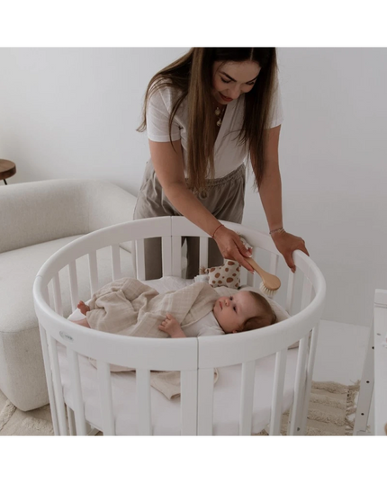 oval baby crib white