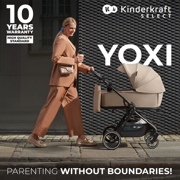 Woman strolling with beige Kinderkraft Stroller YOXI, 10-year warranty.