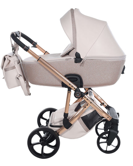 Junama TERMO GLITTER ECO Stroller with stylish gold frame and matching diaper bag, ideal for modern parents.