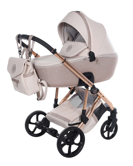 Junama TERMO GLITTER ECO stroller in beige with matching handbag and sleek black wheels.