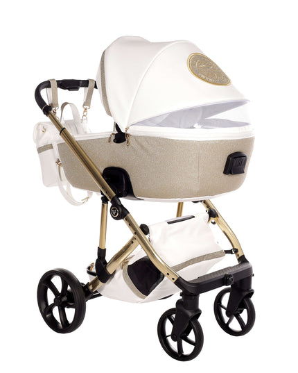 Junama TERMO GLITTER ECO Stroller in elegant white and gold design, featuring a removable infant carrier and spacious storage.