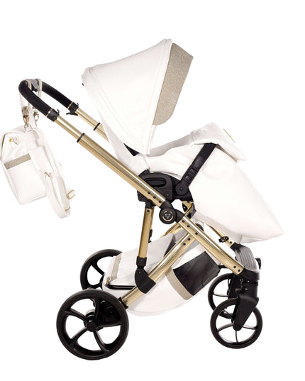 Junama TERMO GLITTER ECO Stroller in white with gold frame and matching diaper bag, ideal for stylish parenting.