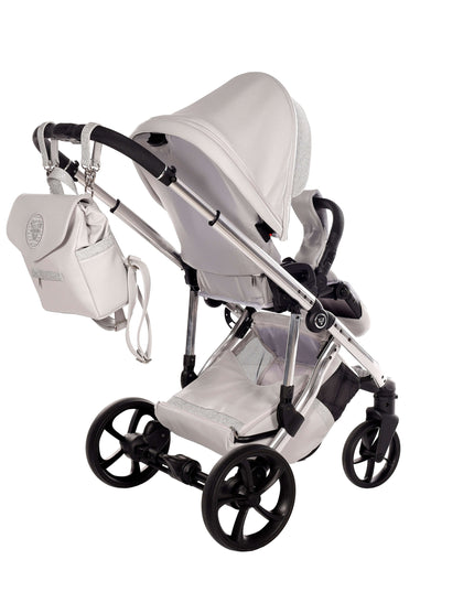 Junama TERMO GLITTER ECO Stroller in grey with backpack, featuring sleek design and durable materials.