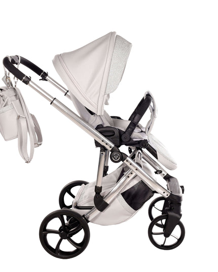 Junama TERMO GLITTER ECO Stroller in sleek white design with adjustable canopy and storage bag.