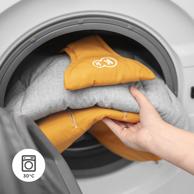 Kinderkraft FELIO 2's washable components in washing machine for easy cleaning.