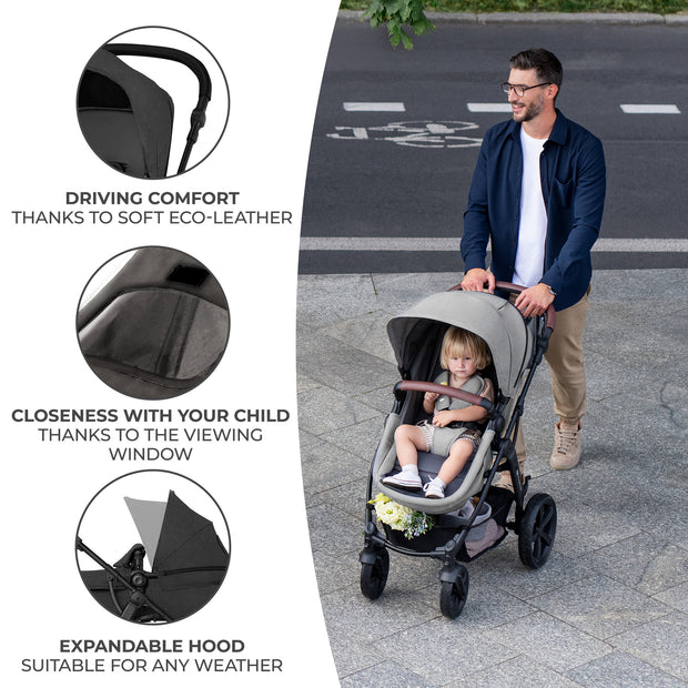 Parent enjoys driving comfort with Kinderkraft MOOV CT's soft eco-leather handle.