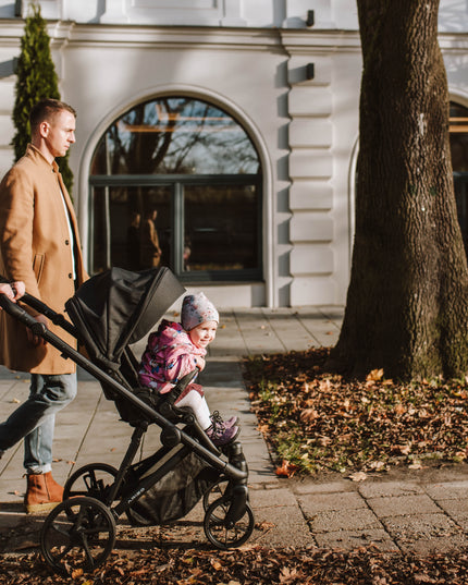 Mother and child enjoying a walk with Kunert ARIZO Stroller.