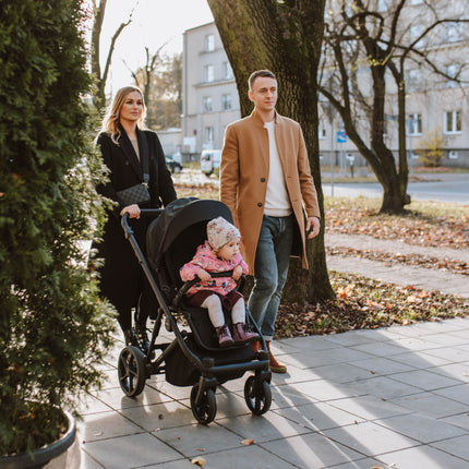 Family and child enjoying a walk with Kunert ARIZO Stroller.