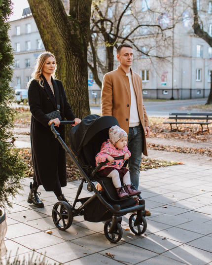 Family with Kunert ARIZO Stroller on a sunny autumn day.