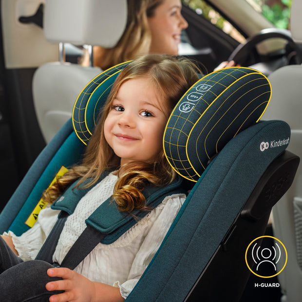Happy child in Kinderkraft Car Seat IGuard with yellow headrest details