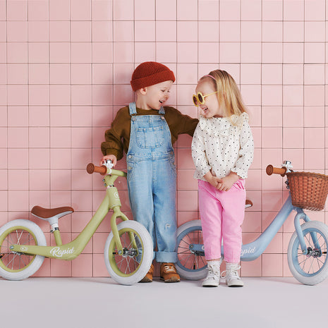 A little boy and a girl with their Kinderaft Bicycle Rapid