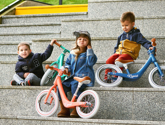 3 Toddlers with their Kinderkraft Balance Bikes RAPID
