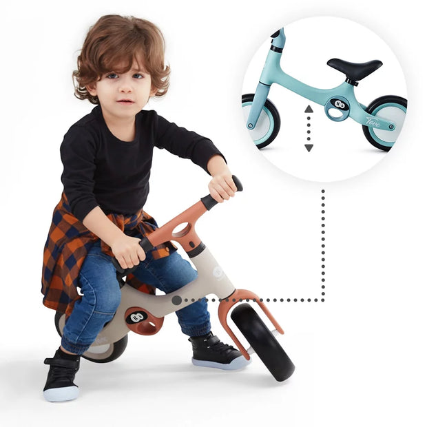 A Baby riding the Kinderkraft Balance Bike TOVE