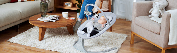 Wide shot of a living room with a Kinderkraft baby bouncer LULI