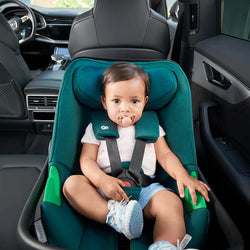 Baby sitting inside the Kinderkraft I-CARE Car Seat in Green