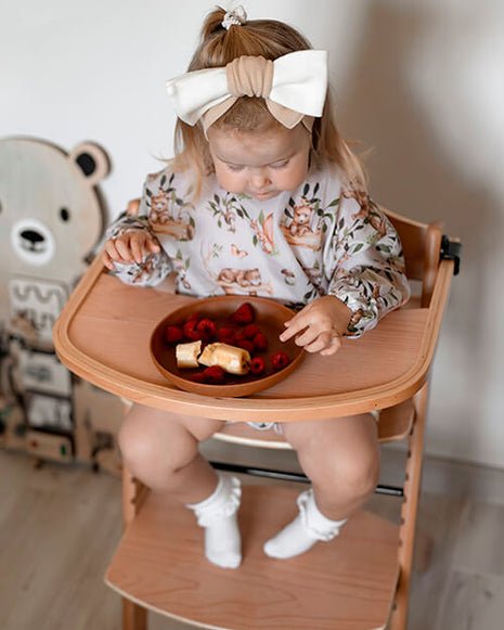 Little Baby Girl eating in the Kinderkraft LIVY & CALMEE High Chair