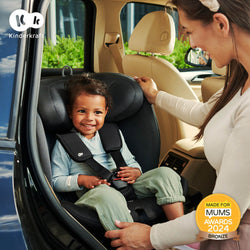 Mother and toddler smilling, while the toddler is inside the Kinderkraft Car Seat