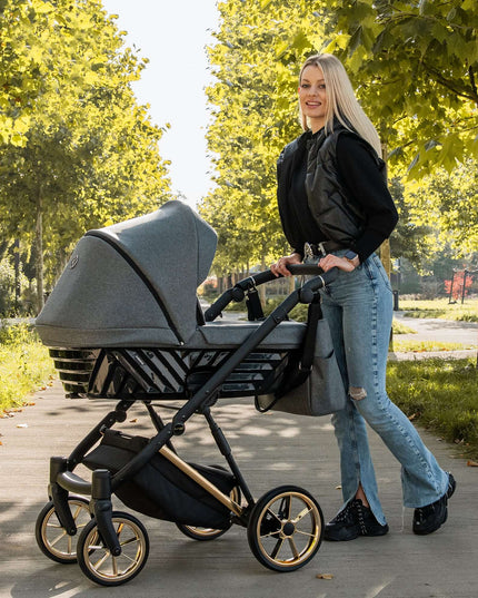 Elegant woman with the Kunert Ivento Stroller in the park