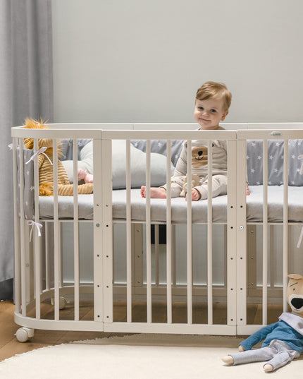 crib with protective barriers