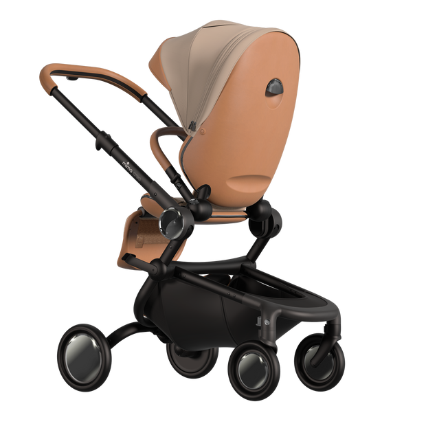 MIMA Creo Stroller in mocha, mother-facing position, zipped canopy, emphasizing stylish and functional features.