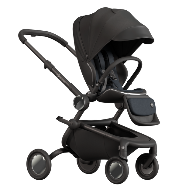 MIMA Creo Stroller in black with unzipped canopy, perspective view, highlighting ergonomic features.