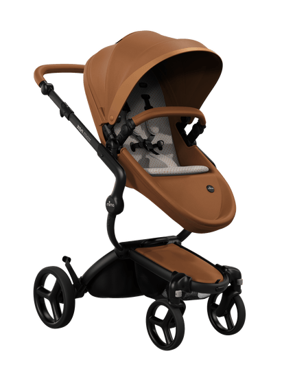 Mima XARI MAX stroller with a camel seat and sandy beige pad on a black chassis, featuring a sleek design.