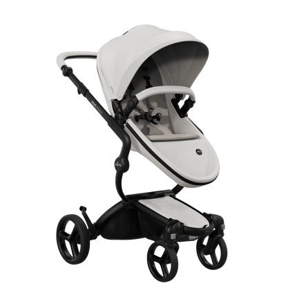 Mima XARI MAX stroller with black chassis, snow white seat, and sandy beige pad, front view.