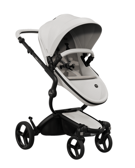 Mima XARI MAX stroller with black chassis, snow white seat, and sandy beige pad, front view.