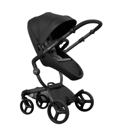 Stylish Mima XARI MAX stroller in black with a ash brown pad, showcasing a reversible black chassis.