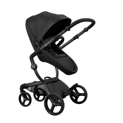 Stylish Mima XARI MAX stroller in black with a black pad, showcasing a reversible black chassis.