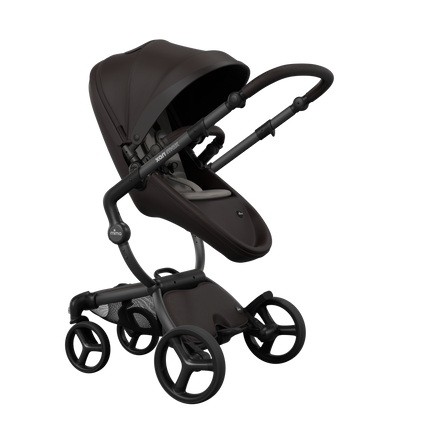 Stylish Mima XARI MAX stroller in chocolate brown with a ash brown pad, showcasing a reversible champagne chassis.