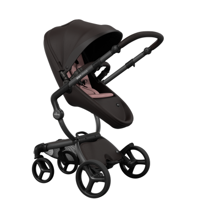 Stylish Mima XARI MAX stroller in chocolate brown with a pink pad, showcasing a reversible champagne chassis.