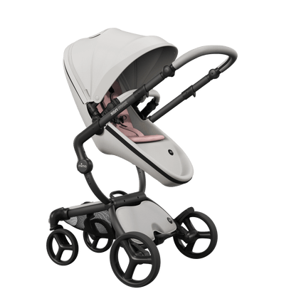 Mima XARI MAX stroller with champagne chassis, snow white seat, and pink pad, facing mother.