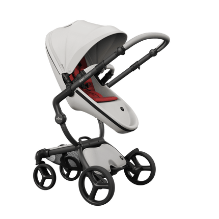 Mima XARI MAX stroller with black chassis, snow white seat, and red pad, side view.