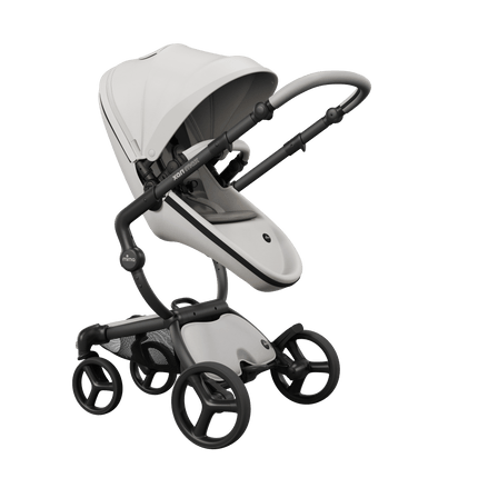 Mima XARI MAX stroller with black chassis, snow white seat, and ash brown pad, side view.