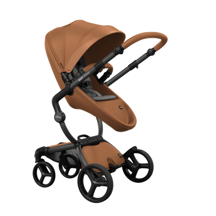 Mima XARI MAX stroller with a camel seat and ash brown pad on a black chassis, featuring a sleek design.