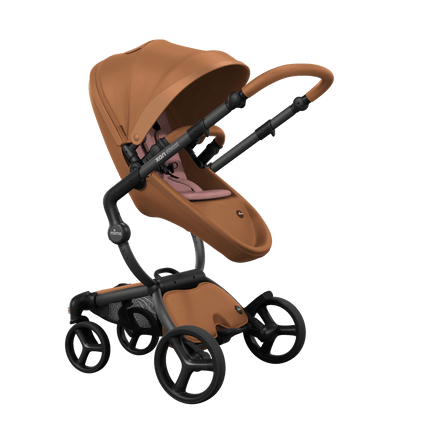 Stylish Mima XARI MAX stroller in camel with a Camel pad, showcasing a reversible black chassis.