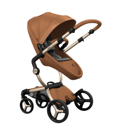 Stylish Mima XARI MAX stroller in camel with a ash brown pad, showcasing a reversible champagne chassis.