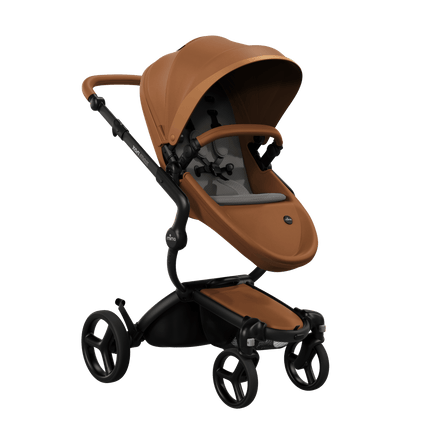 Mima XARI MAX stroller with a camel seat and Ash brown pad on a black chassis, featuring a sleek design.