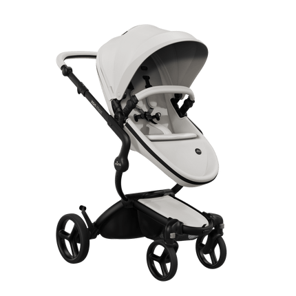 Mima XARI MAX stroller with black chassis, snow white seat, and white pad, side view.