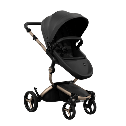 Mima XARI MAX stroller with a black seat and black pad on a champagne chassis, featuring a sleek design.