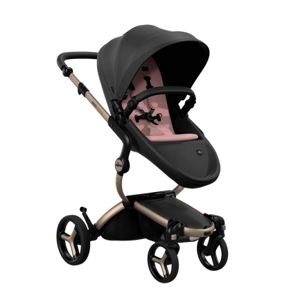 Mima XARI MAX stroller with a black seat and pink pad on a champagne chassis, featuring a sleek design.