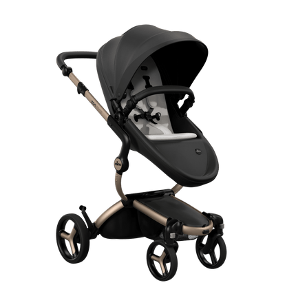 Mima XARI MAX stroller with a black seat and white pad on a champagne chassis, featuring a sleek design.