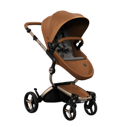 Mima XARI MAX stroller with a camel seat and ash brown pad on a champge chassis, featuring a sleek design.