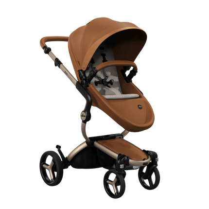 Mima XARI MAX stroller with a camel seat and sandy beige pad on a champge chassis, featuring a sleek design.