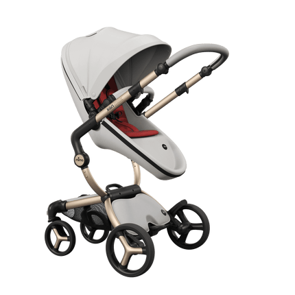 Mima XARI MAX stroller, mother-facing configuration, champagne chassis, snow white seat, and bold red pad.