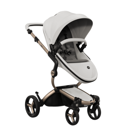 Mima XARI MAX stroller with champagne chassis, snow white seat, and ash brown pad, elegant design for modern parents.