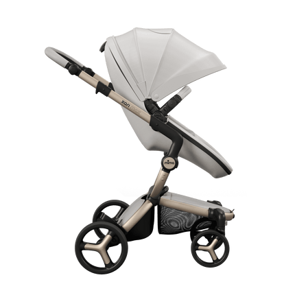 Mima XARI MAX stroller with unzipped canopy, champagne chassis, snow white seat, and white pad, sleek and functional.